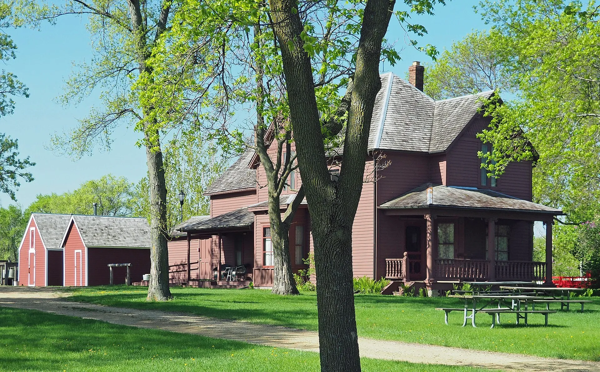 The historic Eidem Homestead farmhouse and red barn in Brooklyn Park