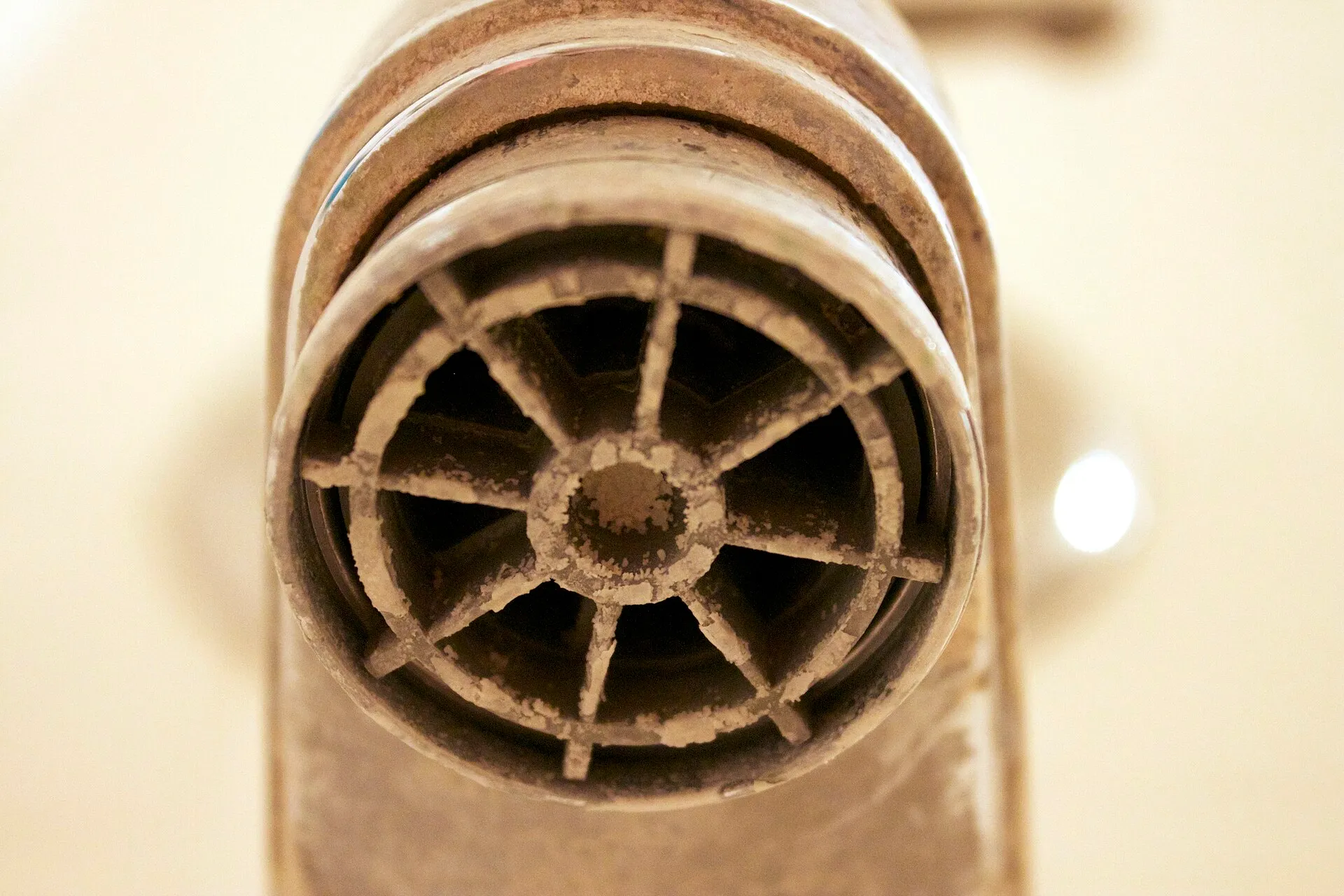 Heavy limescale caked onto a faucet aerator