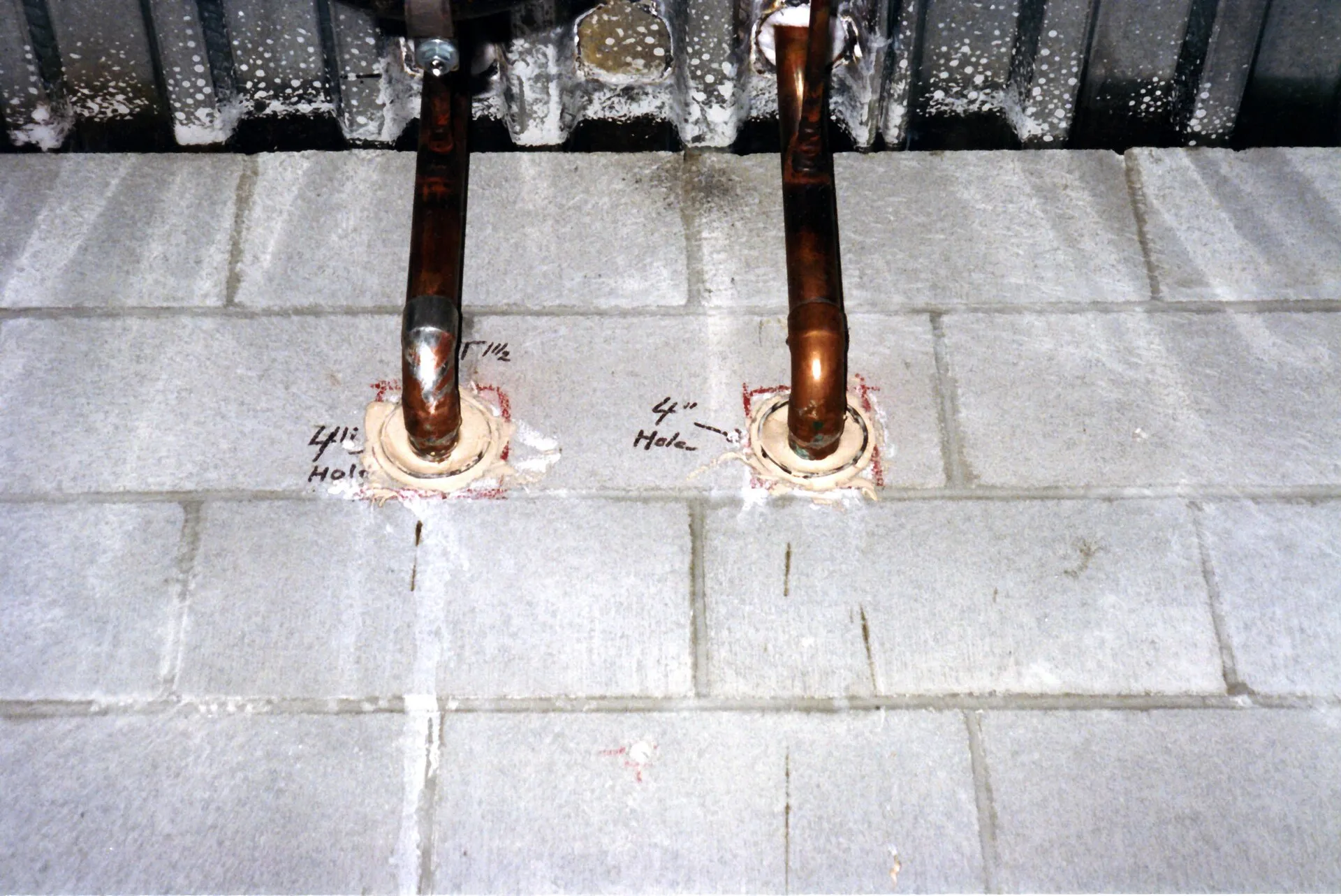 Copper water pipes entering a home