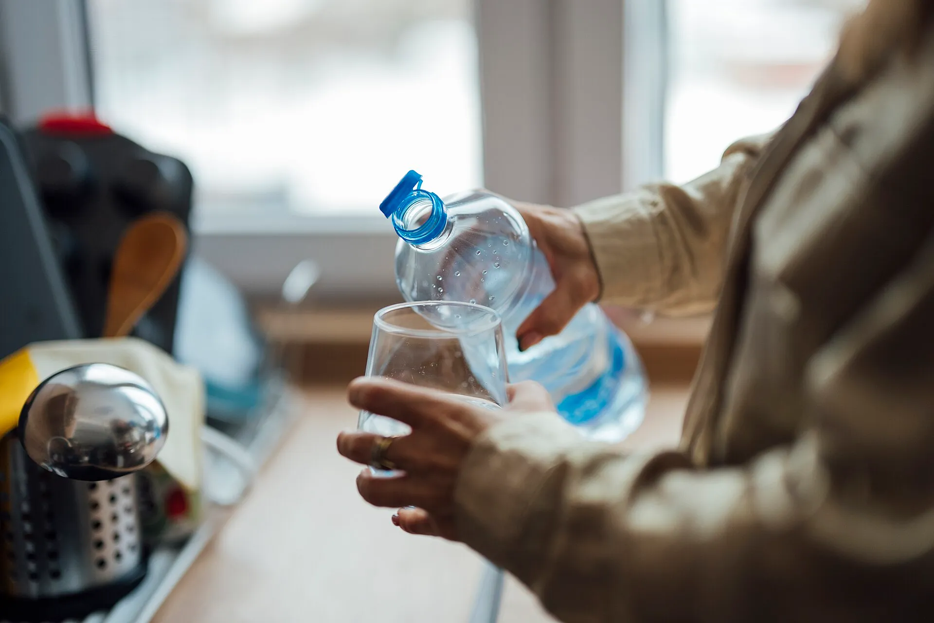 Water being poured into a drinking glass