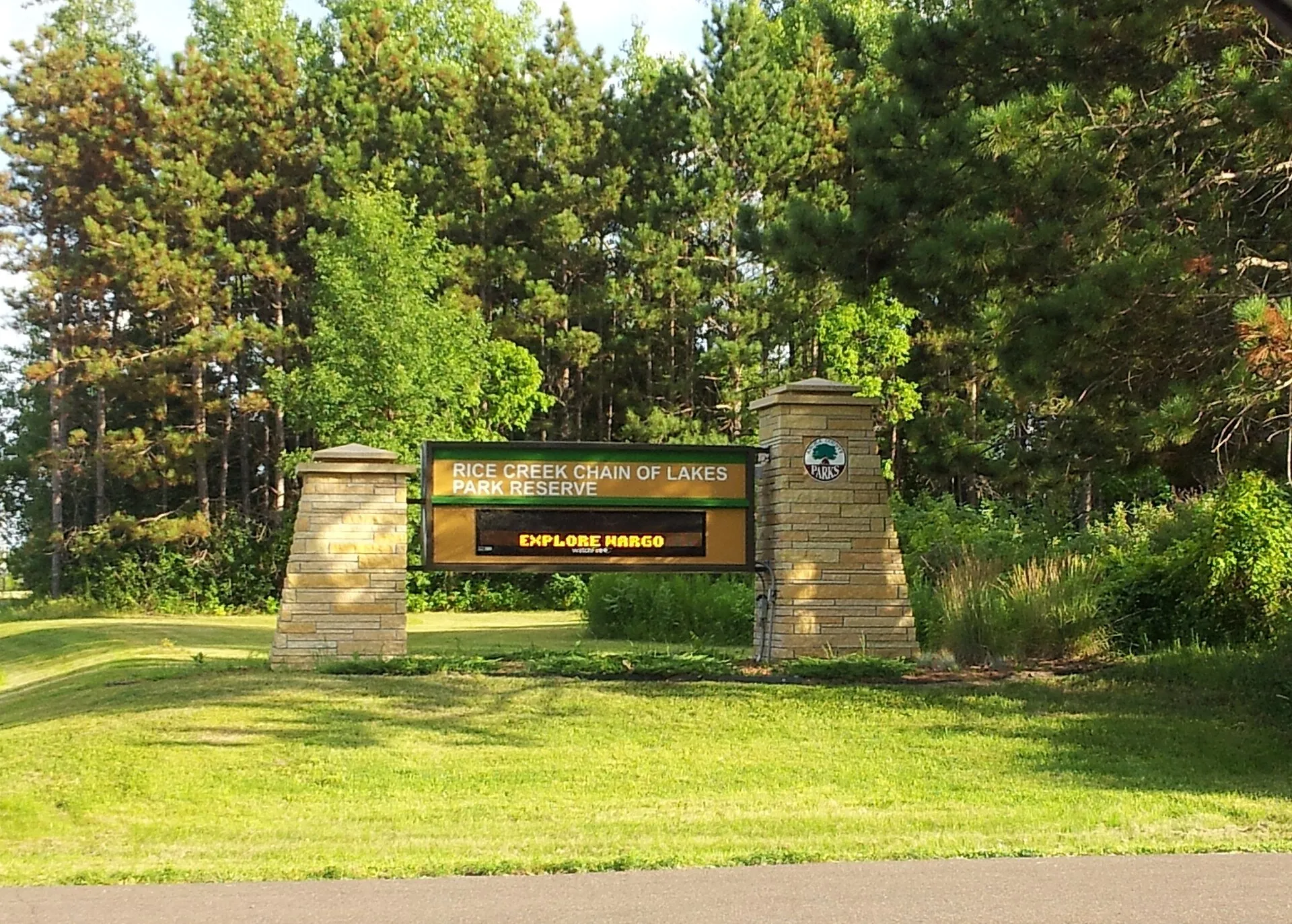 The stone entrance sign to Rice Creek Chain of Lakes Regional Park in Lino Lakes