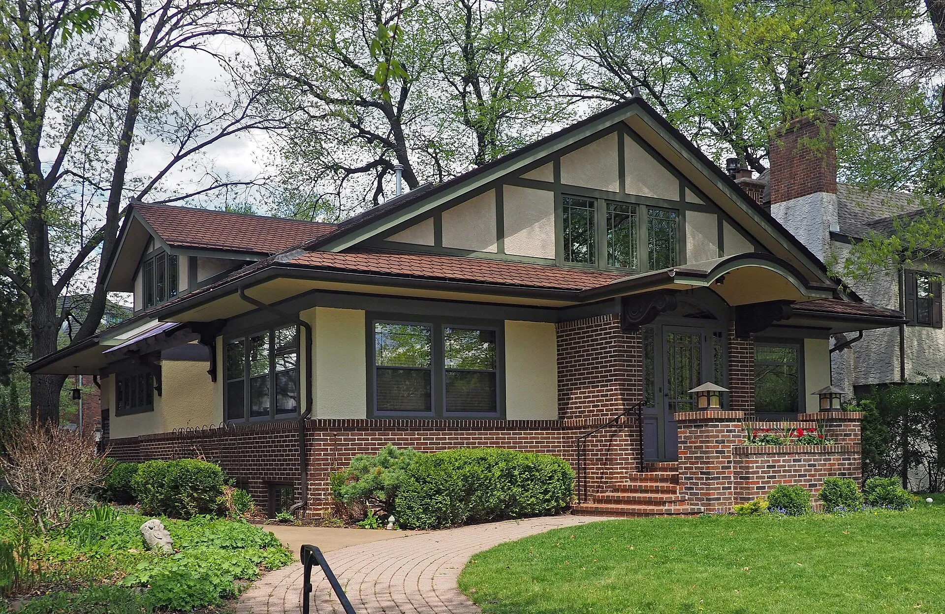 The Floyd B. Olson House, a Prairie-style brick home on a tree-lined Minneapolis street