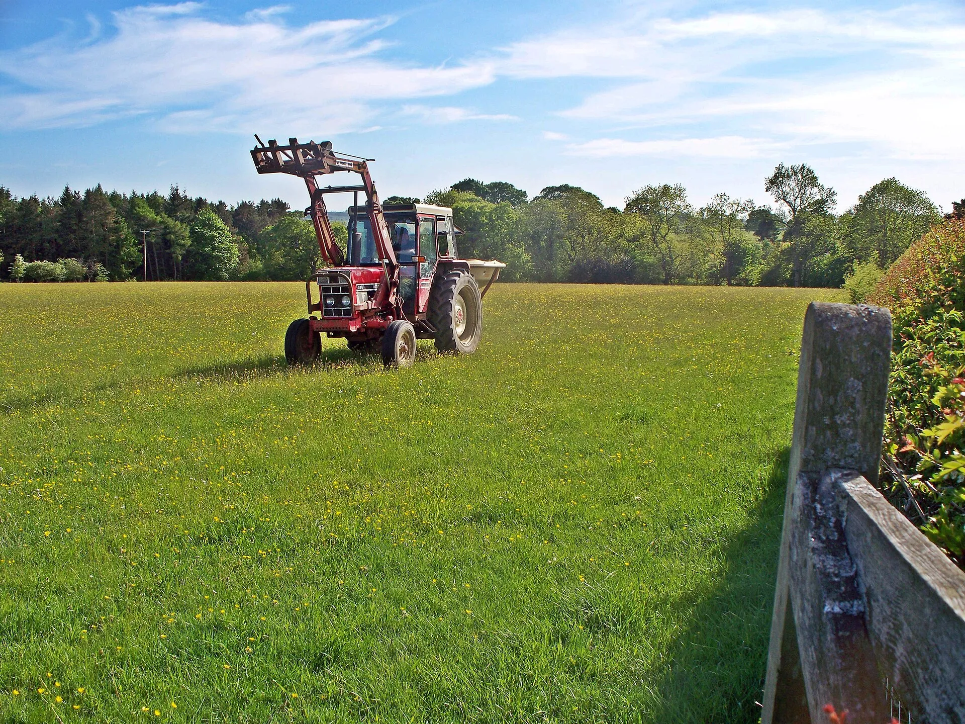 A tractor working a farm field