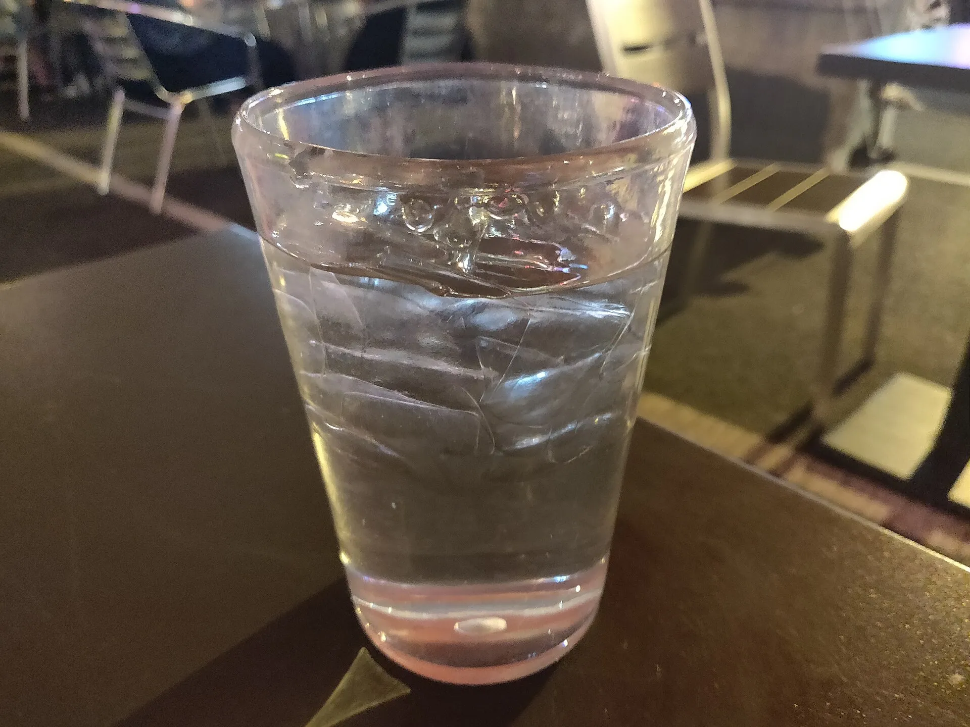 A clear glass of water on a counter