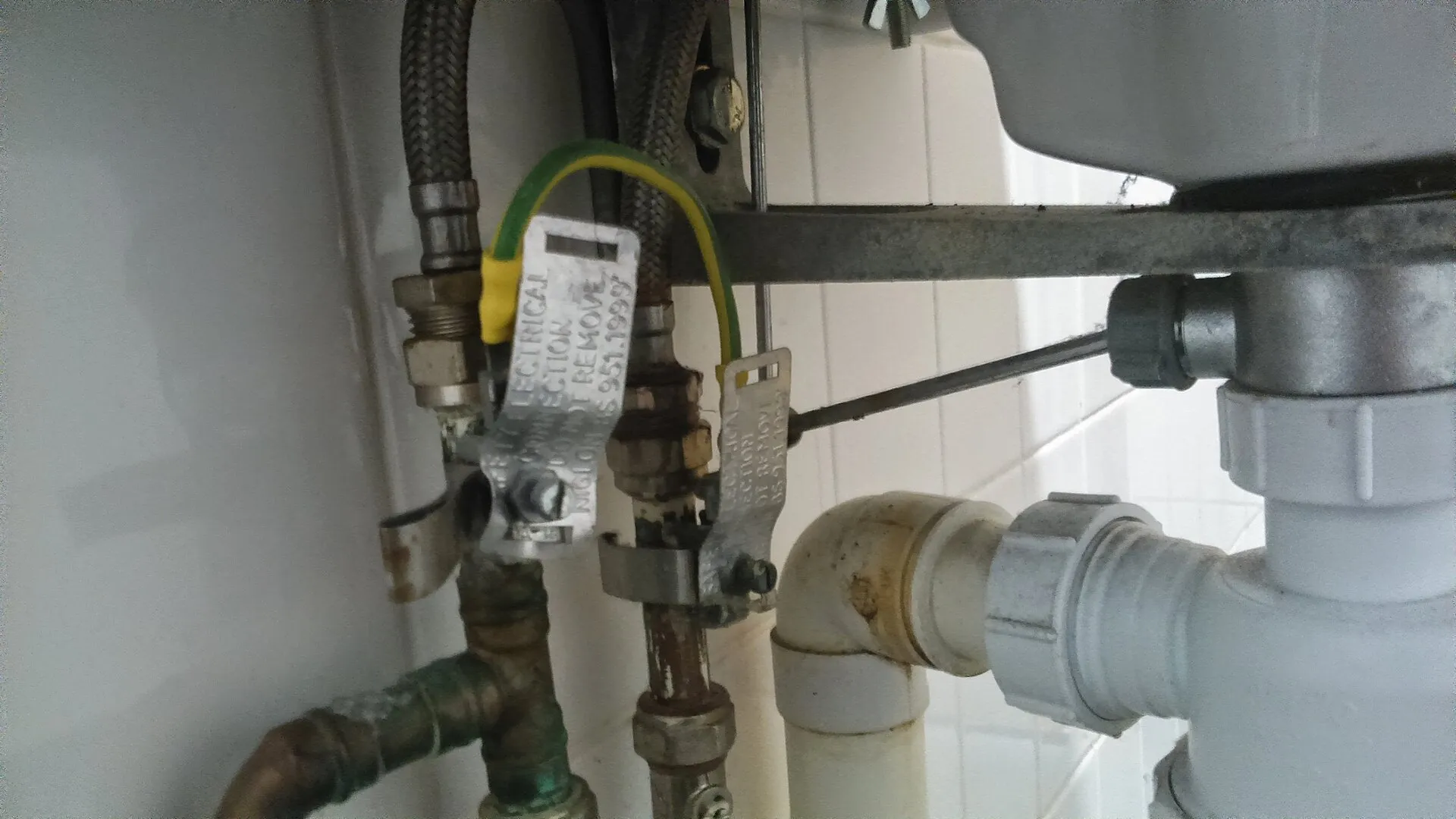 Copper supply lines and shutoff valves under a sink