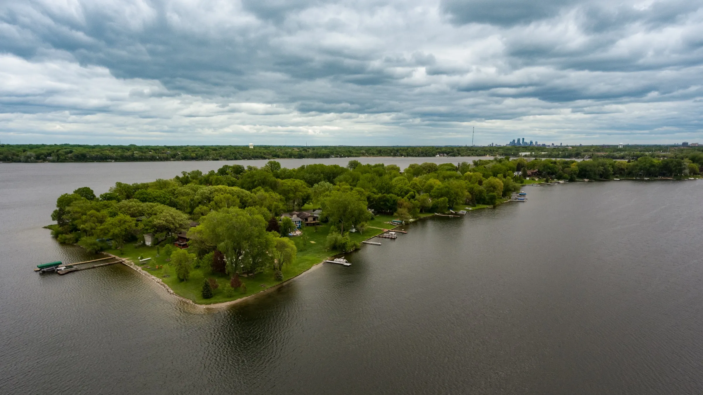 Aerial view of Medicine Lake in Plymouth with the Minneapolis skyline beyond