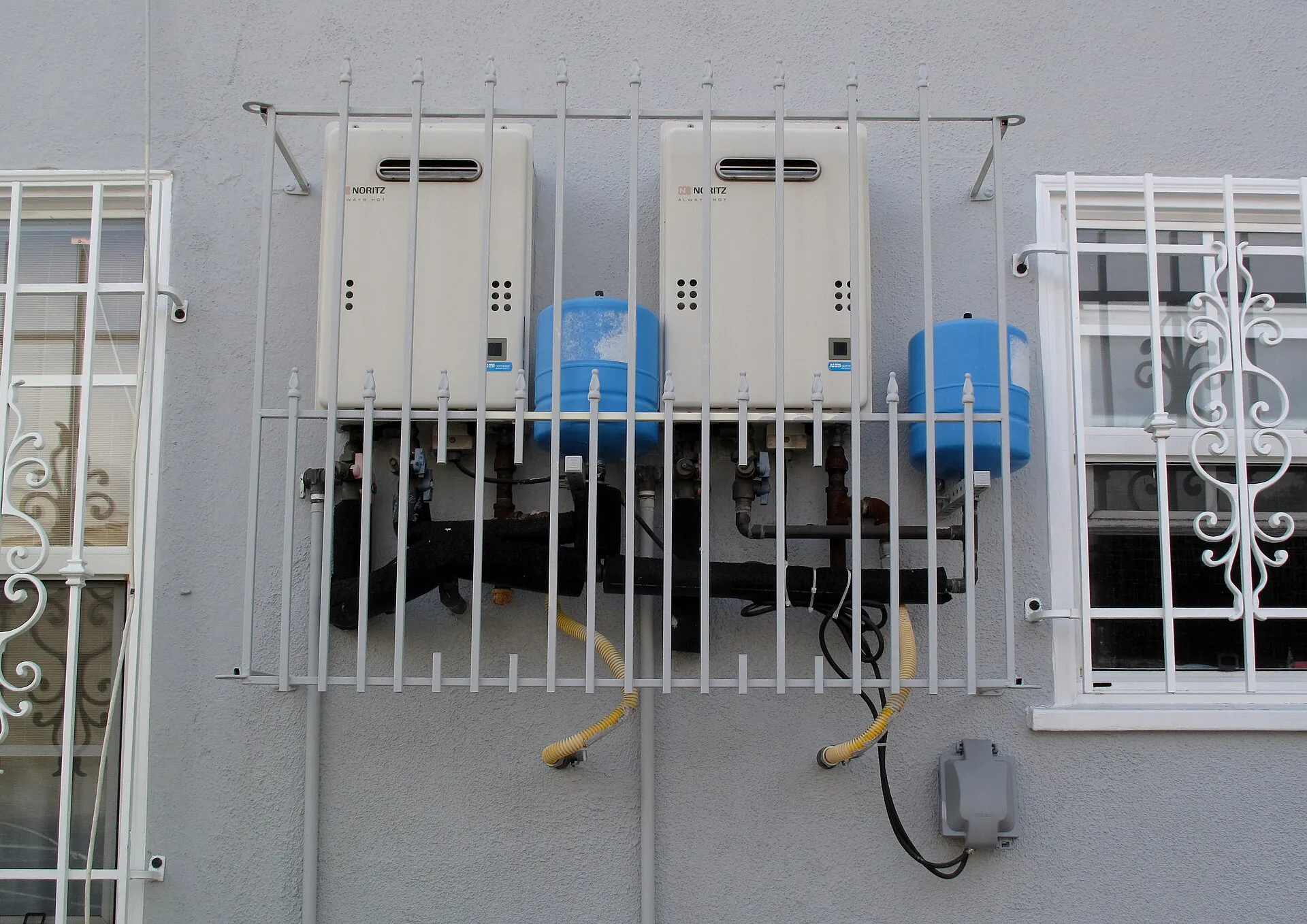 Tankless water heaters mounted on a wall