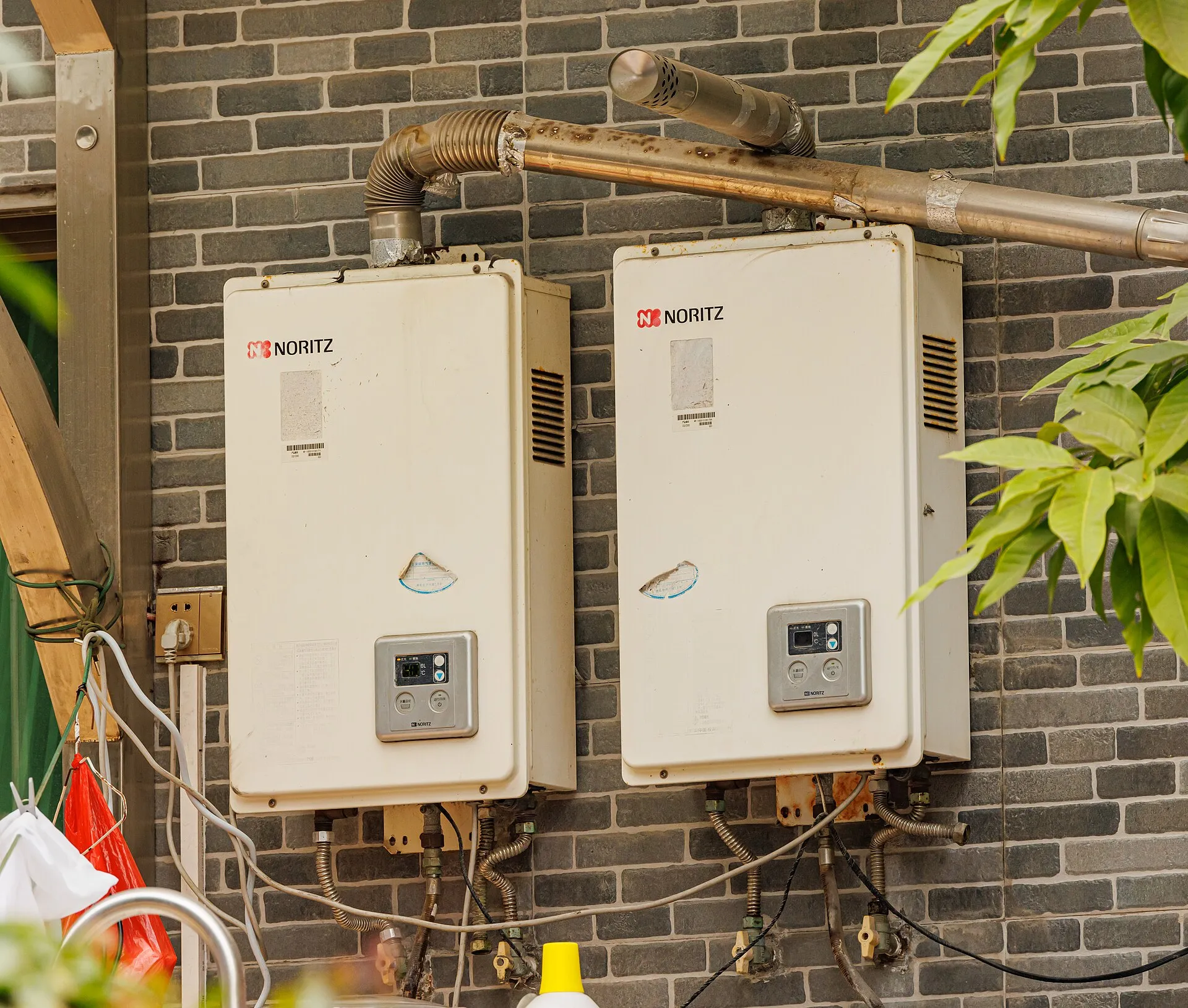 Wall-mounted residential tankless water heaters